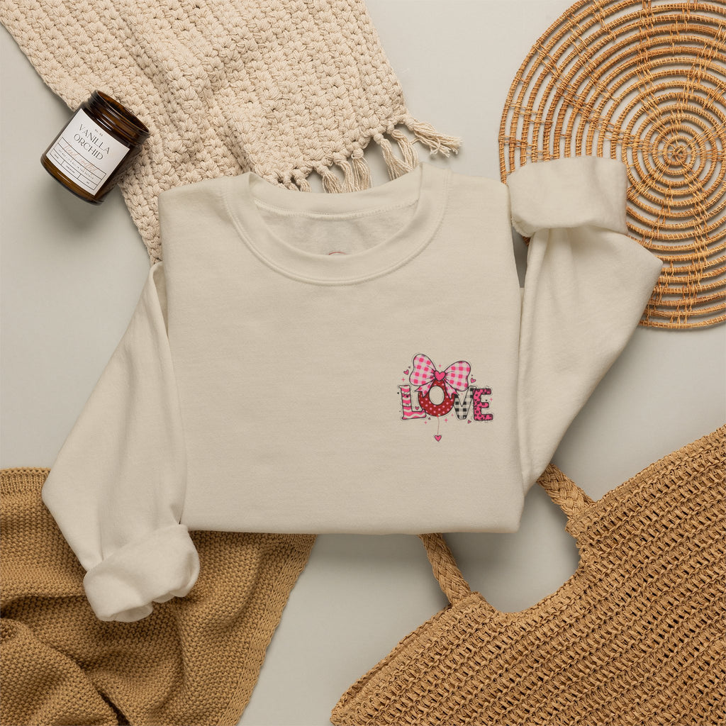 An off-white crewneck sweatshirt with a colorful cartoon graphic 