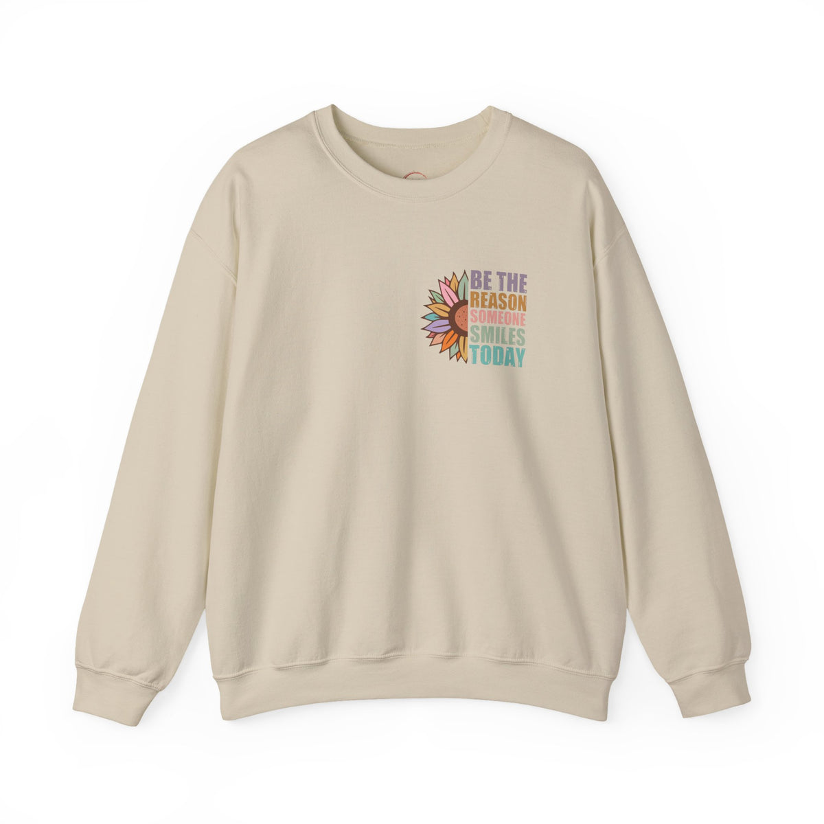 A light gray crewneck sweatshirt featuring a graphic print on the left chest of a black face wearing a gold hat, with the text 'Blind Devotion' printed vertically. The left sleeve also features vertical text reading 'Self Acceptance Self Love'.
