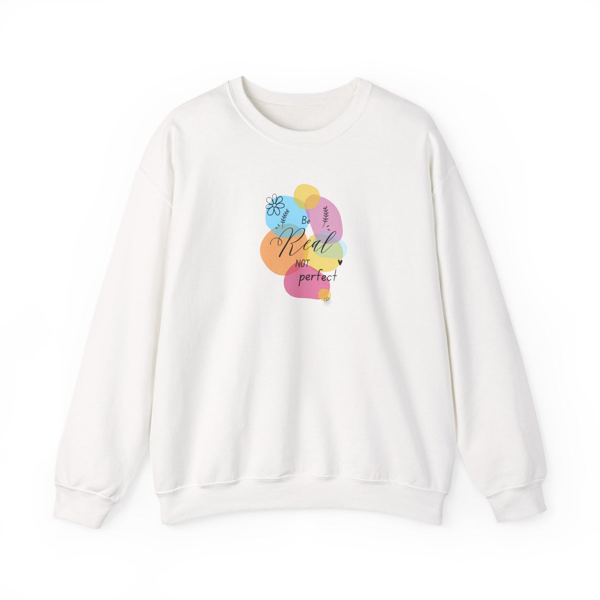 An off-white crewneck sweatshirt featuring a colorful graphic on the chest with overlapping pastel balloons and the text 'Real life is perfect!'.