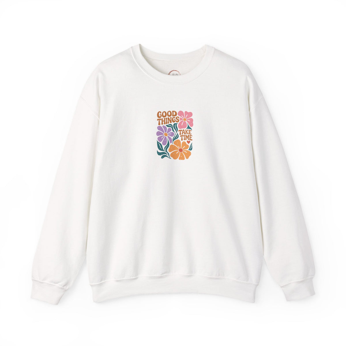 An off-white crewneck sweatshirt featuring a retro-style floral graphic on the chest with the text 'GOOD THINGS WILL COME' in orange and multicolored flowers.