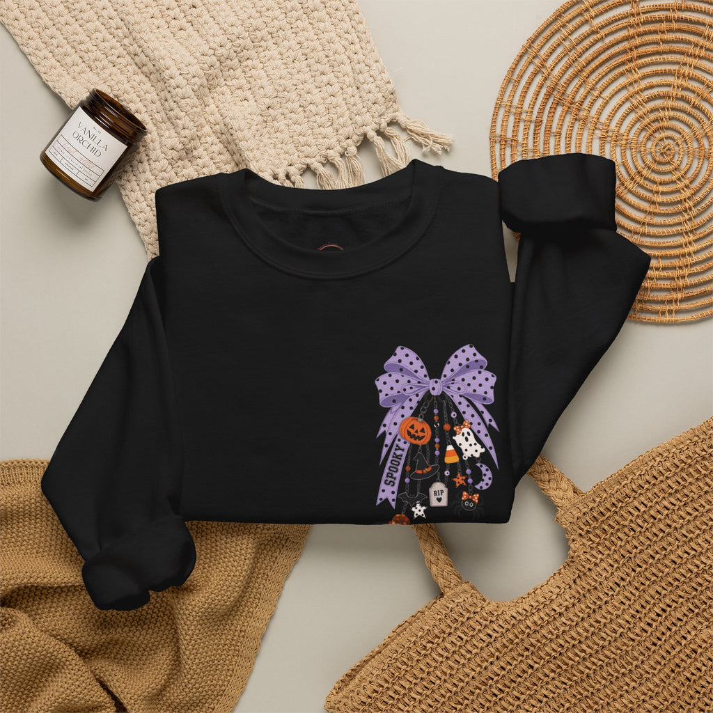Black sweatshirt with a printed design on a textured surface