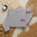 Gray sweatshirt with 'Apéro Time' and martini glass design on a textured surface.