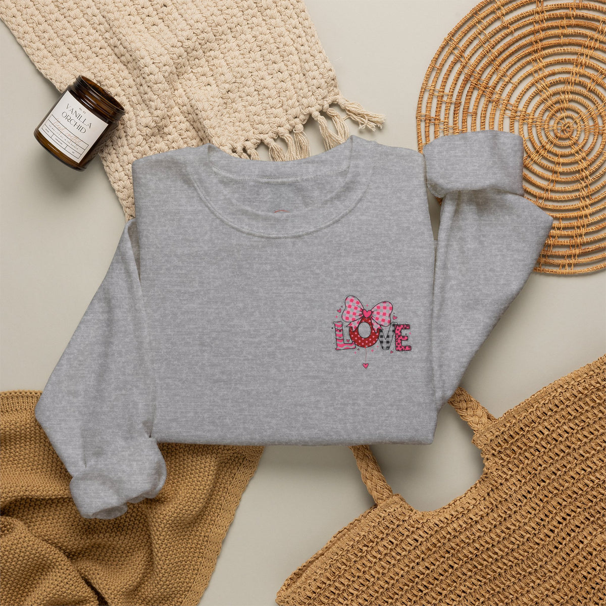 Gray sweatshirt with 'Apéro Time' and martini glass design on a textured surface.